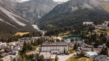 Aerial view of Arosa with a lake, buildings and mountains