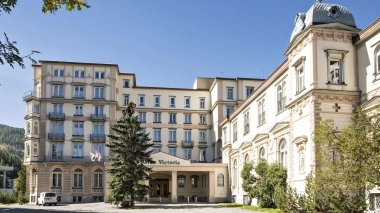 Exterior view of a hotel in sunshine