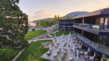 Modern building with garden and lake view
