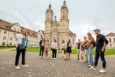 Group on a city tour in front of a historic church.