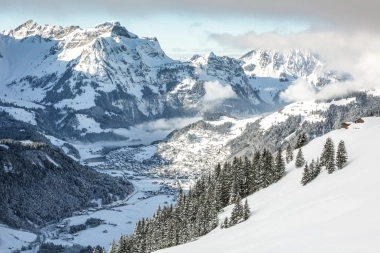 Snow-covered winter landscape with mountains in Engelberg