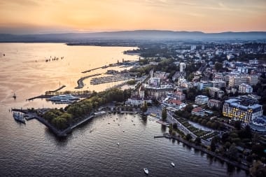 The city of Lausanne on Lake Geneva at dusk